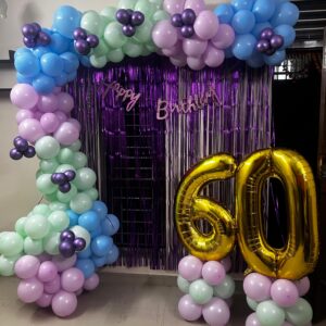 Luxury royal glam birthday balloon arch setup with chrome and confetti balloons