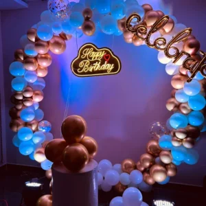 Luxury blue and gold balloon ring arch birthday decoration with LED Happy Birthday sign by Vruddhi Events in Hyderabad