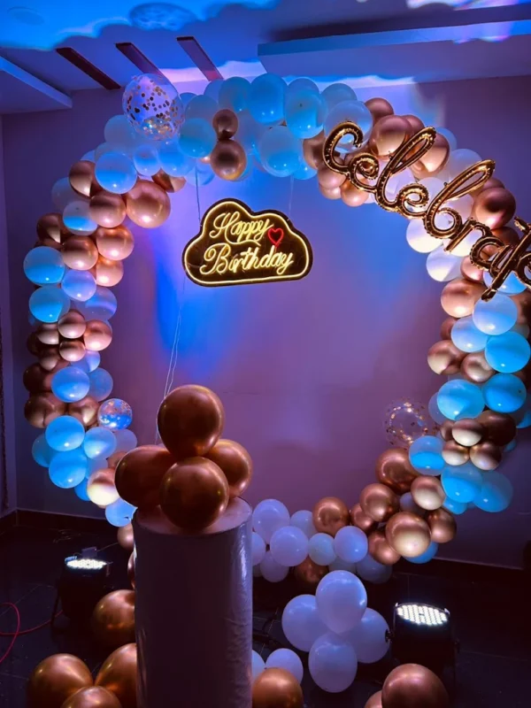 Luxury blue and gold balloon ring arch birthday decoration with LED Happy Birthday sign by Vruddhi Events in Hyderabad