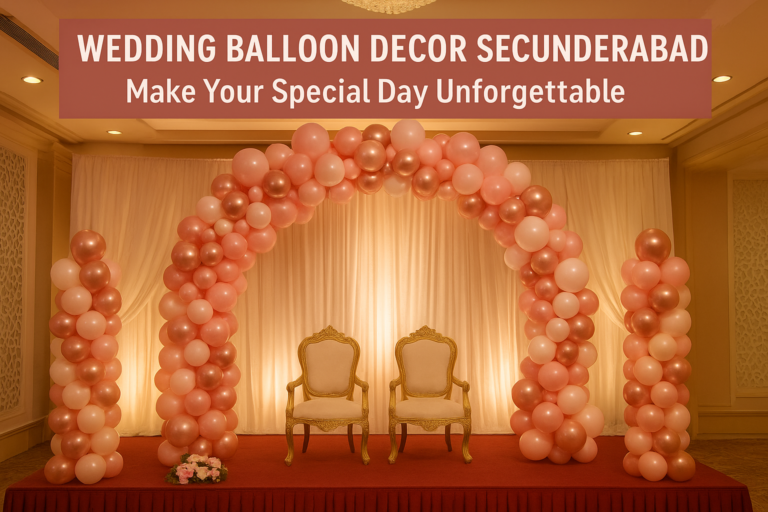 Elegant wedding balloon decor Secunderabad with pastel pink and rose gold balloon arch, golden chairs on stage, and soft drapery backdrop creating a romantic atmosphere.
