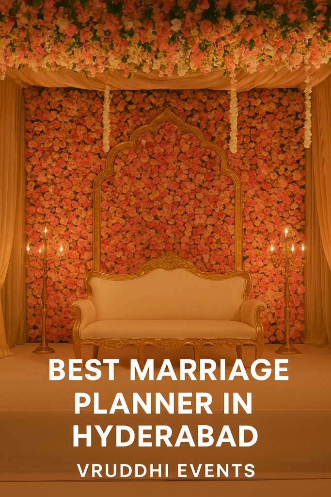 Luxurious wedding stage setup by Vruddhi Events, the best marriage planner in Hyderabad, featuring a floral backdrop, golden sofa, and elegant lighting.