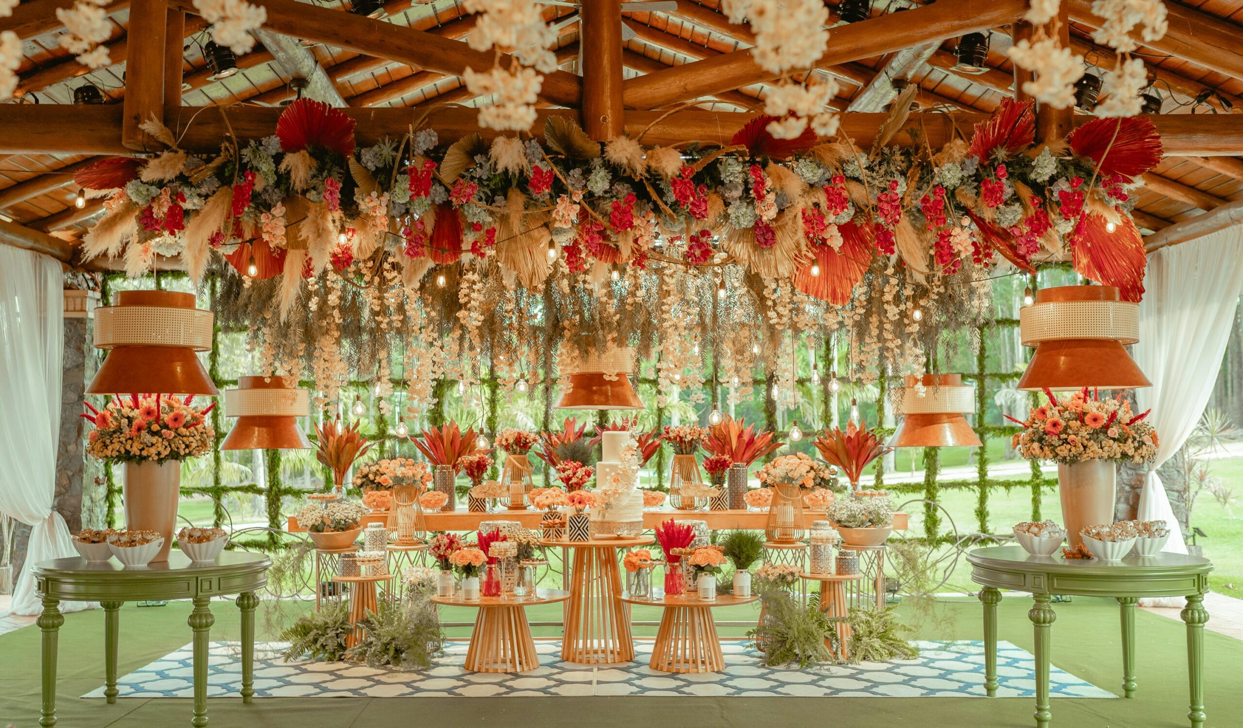 Beautifully decorated Luxury Outdoor Décor ceremony with vibrant floral arrangements and elegant tables.